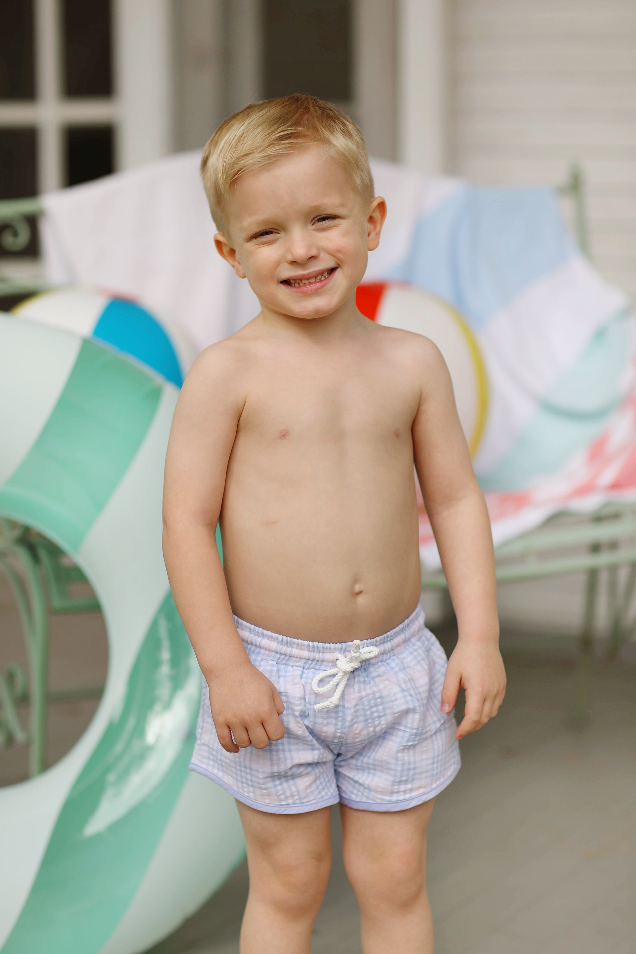 Pink and store blue swim trunks